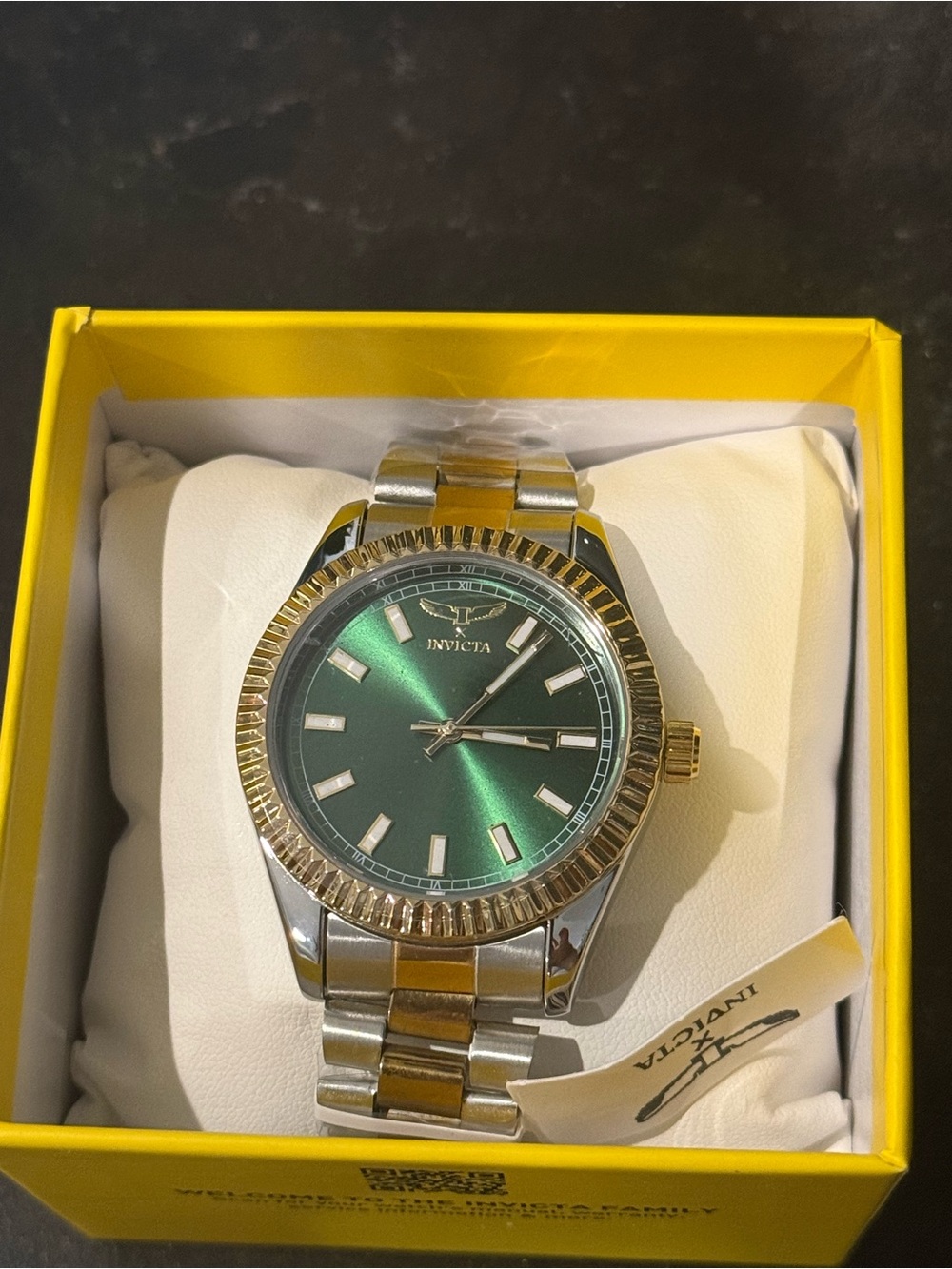 Invicta Specialty 69012 men's quartz watch featuring a green sunray dial